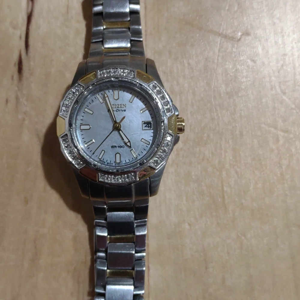 Citizen Eco-Drive silver with gold and rhinestone accents